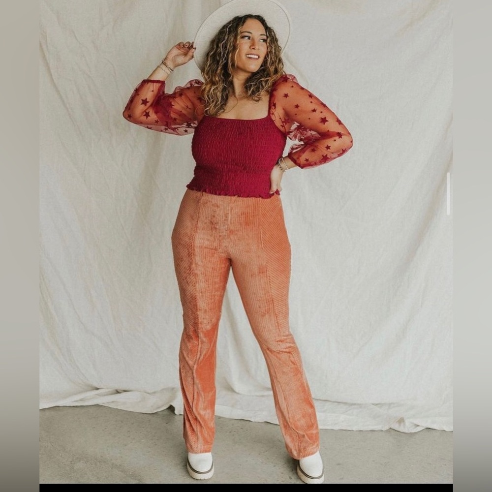 CREAMSICLE VELEVT FLARES  from shop henly. Size small
